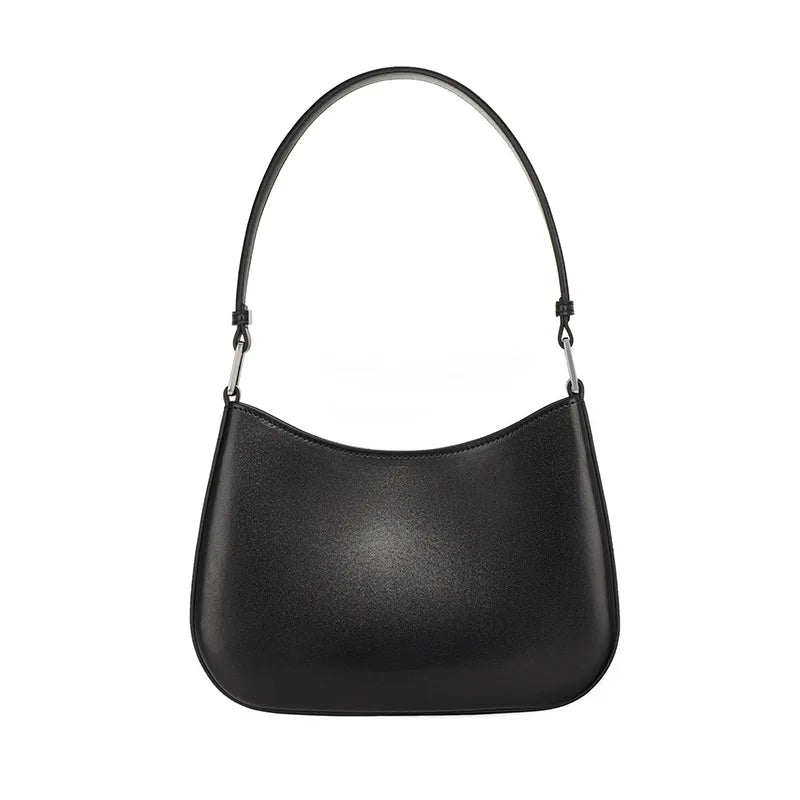 Sac à main femme en cuir noir élégant, style chic parisien, idéal pour un look sophistiqué.