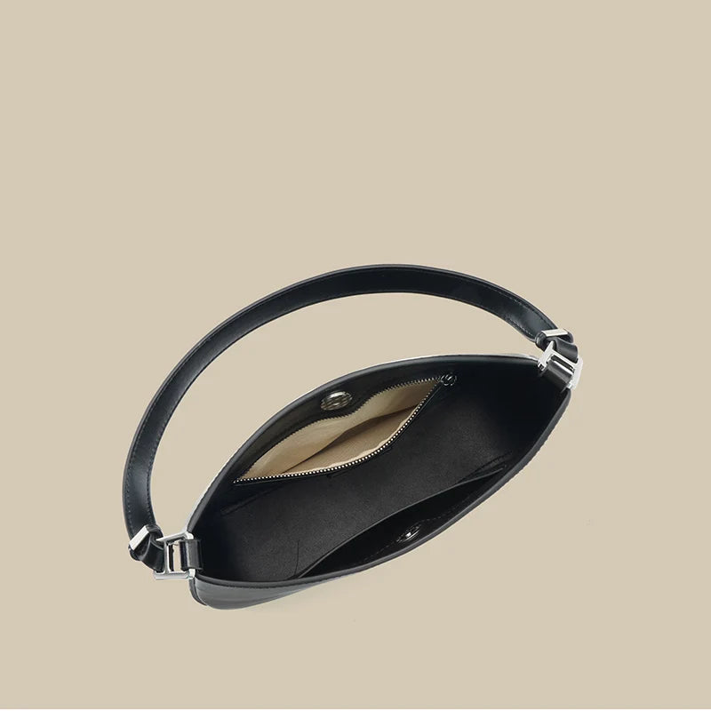 Sac à main femme en cuir noir, design intemporel, parfait pour toutes les occasions, élégance assurée.