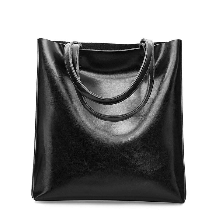 Sac à bandoulière vintage en cuir pour femme, accessoire de mode et maroquinerie chic.