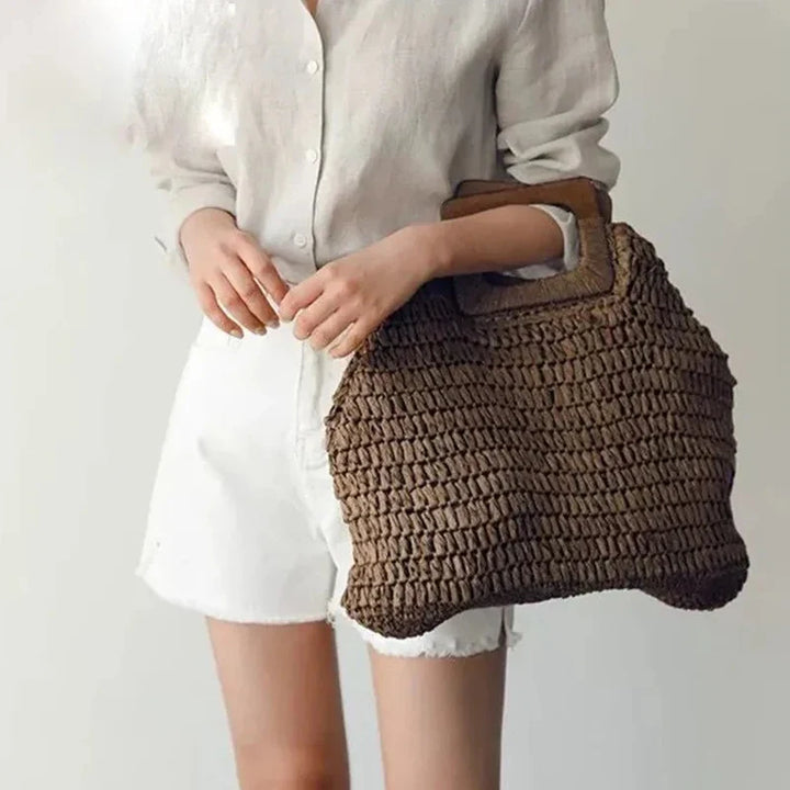 Sac à main femme en paille tressée, chic, idéal pour les sorties d'été et la plage.