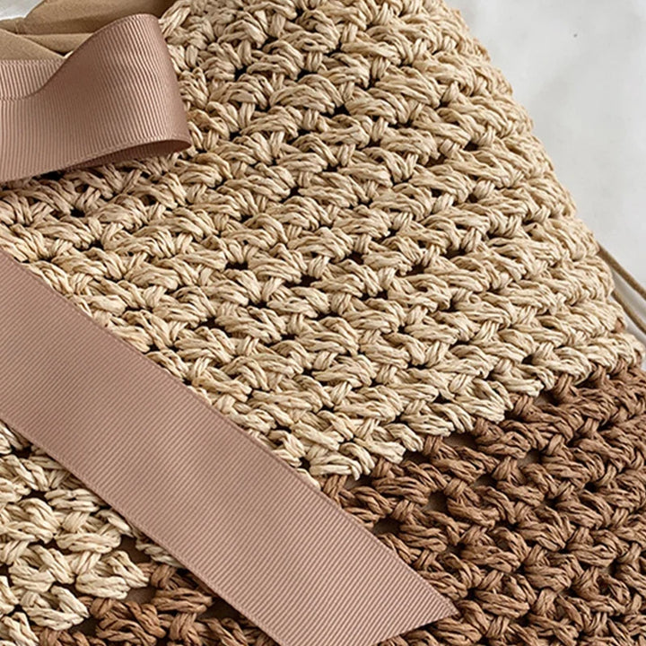 Sac bandoulière femme en paille tressée, léger et élégant, parfait pour l'été et les vacances.