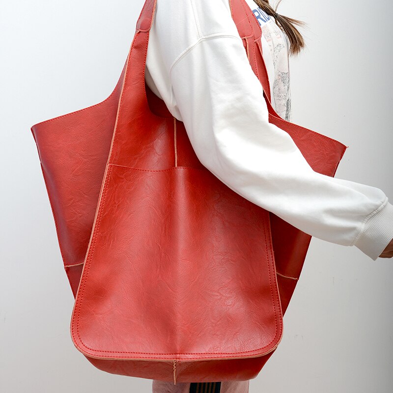 Sac à main femme grand volume et polyvalent en cuir PU, un choix mode élégant pour vos journées actives.