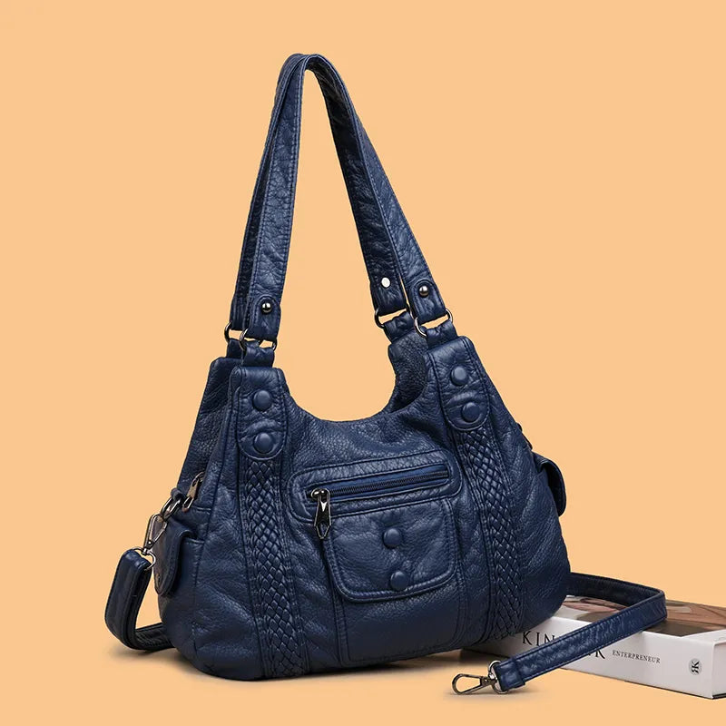 Sac à main femme vintage bleu canard, en similicuir vieilli. Sac élégant et pratique pour usage quotidien.