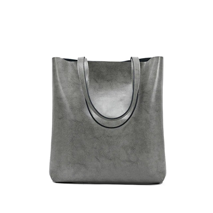 Sac à main femme en cuir fendu multicolore, un accessoire de mode élégant et polyvalent.