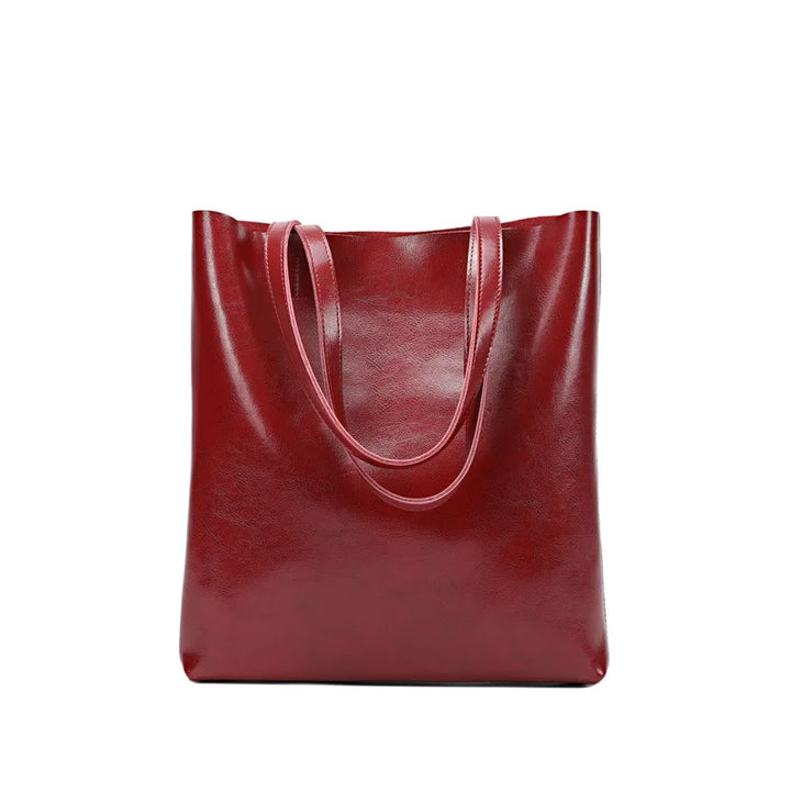 Sac porté épaule femme en cuir fendu, design élégant et spacieux, parfait pour le travail ou loisirs.