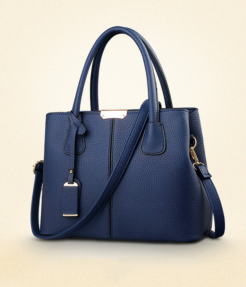 Sac à main femme élégant en cuir PU bleu marine avec bandoulière. Idéal pour usage quotidien et shopping.