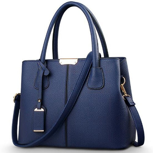 Sac à main polyvalent femme en cuir PU recyclé bleu marine. Accessoire mode écologique pour toutes occasions.