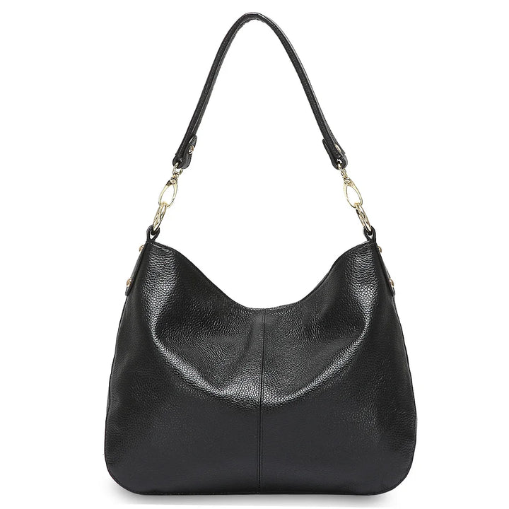 Vue de côté d'un sac à main femme élégant en cuir souple, montrant sa forme et sa structure.