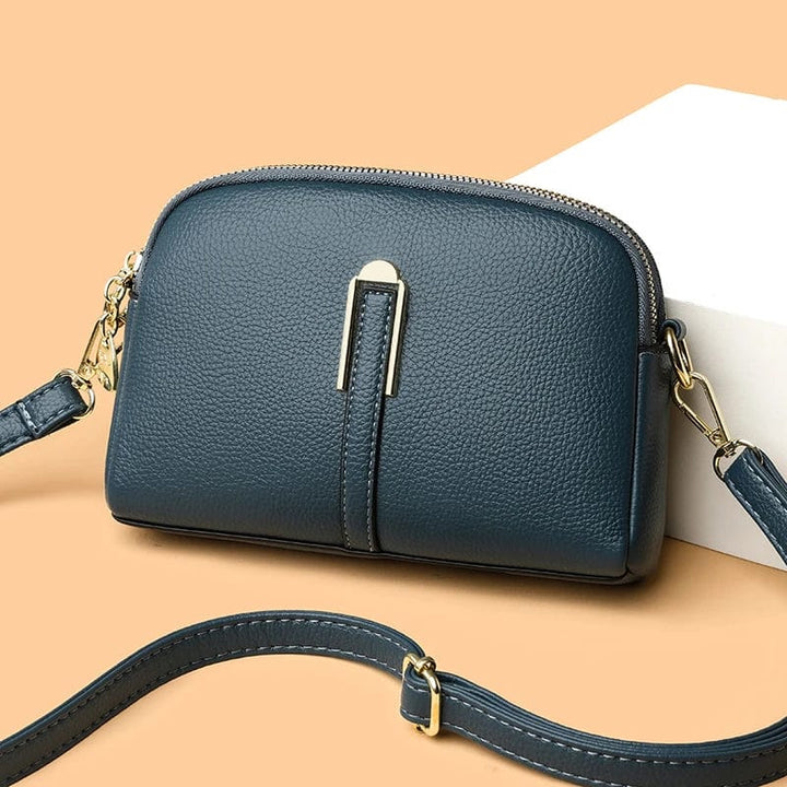 Sac cuir vegan femme avec bandoulière, design élégant et moderne, couleur gris perle.