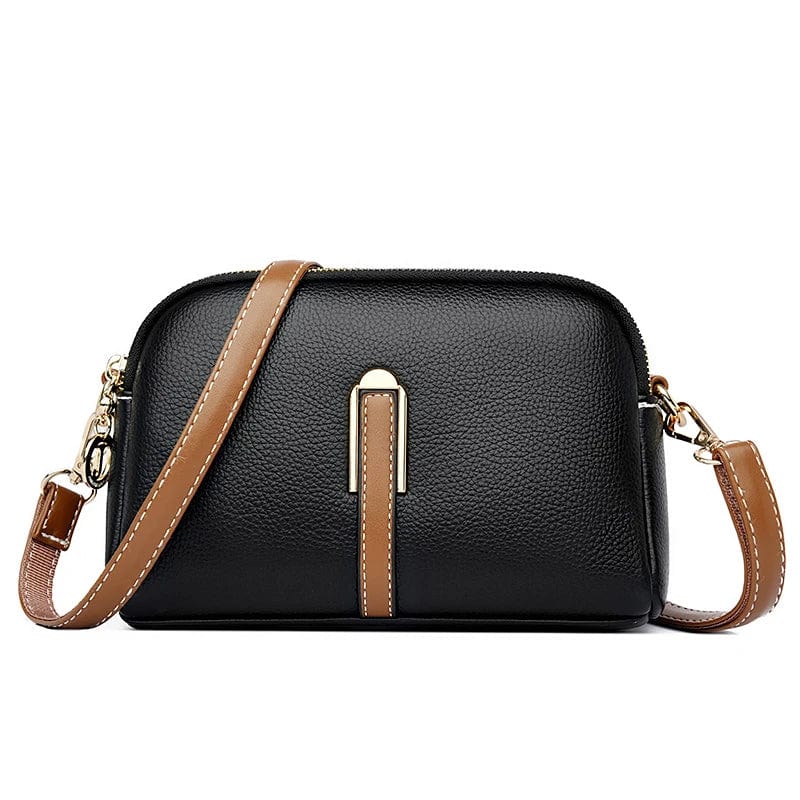 Sac à main femme en cuir vegan marron avec fermeture éclair dorée, accessoire mode et pratique.