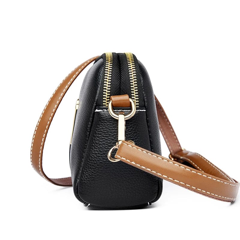 Gros plan d'un sac à main femme en cuir vegan grainé, présentant la texture et les coutures fines.