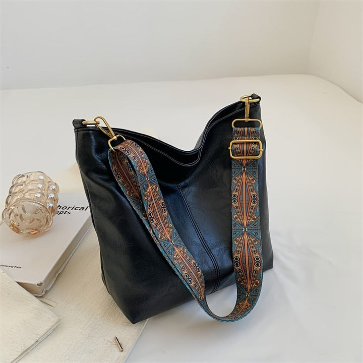 Sac à main femme en cuir vegan, style vintage. Accessoire quotidien élégant et mode éthique.
