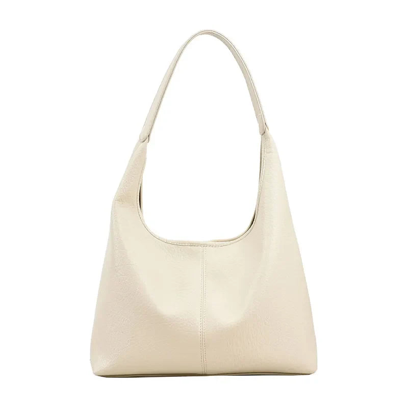 Élégant sac à main hobo en cuir vieilli pour femme, idéal pour un look quotidien.