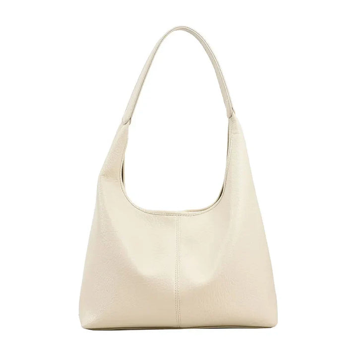 Élégant sac à main hobo en cuir vieilli pour femme, idéal pour un look quotidien.