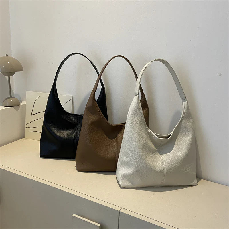 Sac à main femme en cuir vieilli, design élégant et pratique pour la mode quotidienne.
