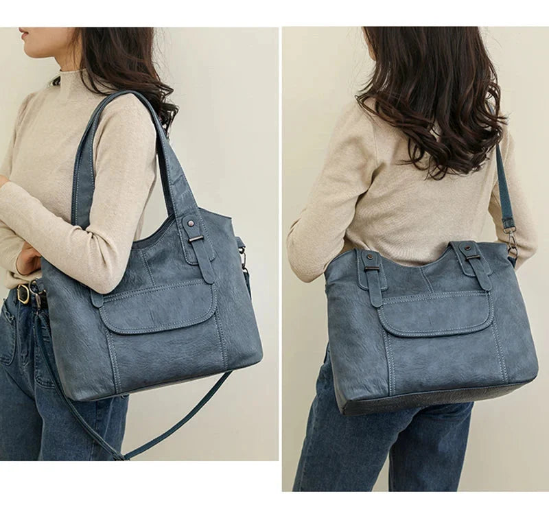 Sac à main femme noir, porté épaule, révélant sa capacité et son design élégant.