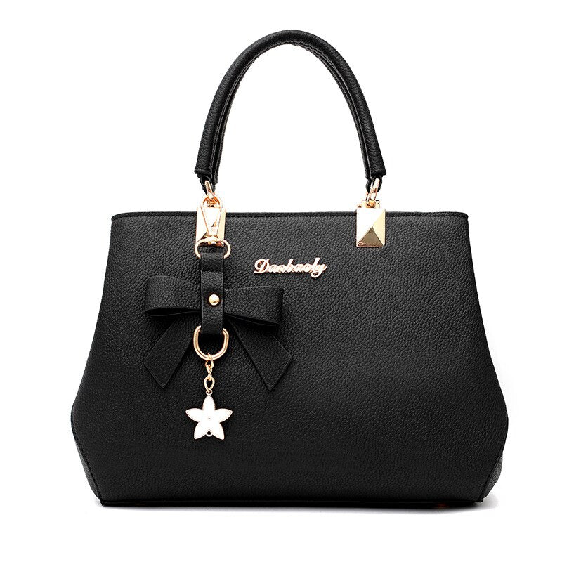 Sac à main femme élégant en similicuir noir avec bandoulière, idéal pour le quotidien.