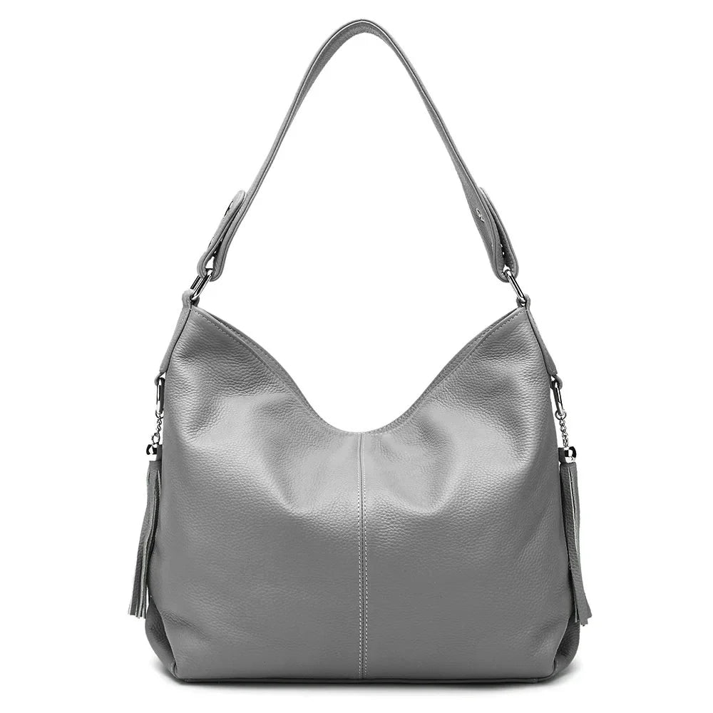 Sac femme polyvalent, grand format. Design élégant en cuir synthétique. Idéal pour un look chic au quotidien.