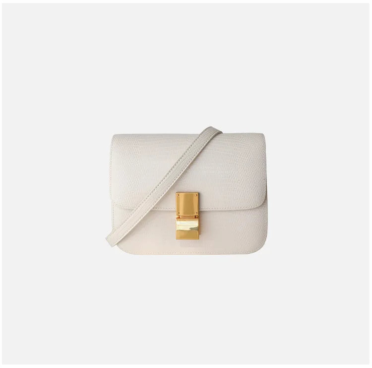 Dos du sac à main femme motif croco, présentant un design épuré et chic.