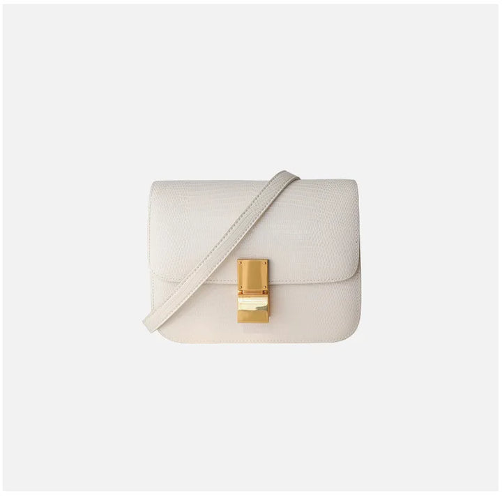 Dos du sac à main femme motif croco, présentant un design épuré et chic.