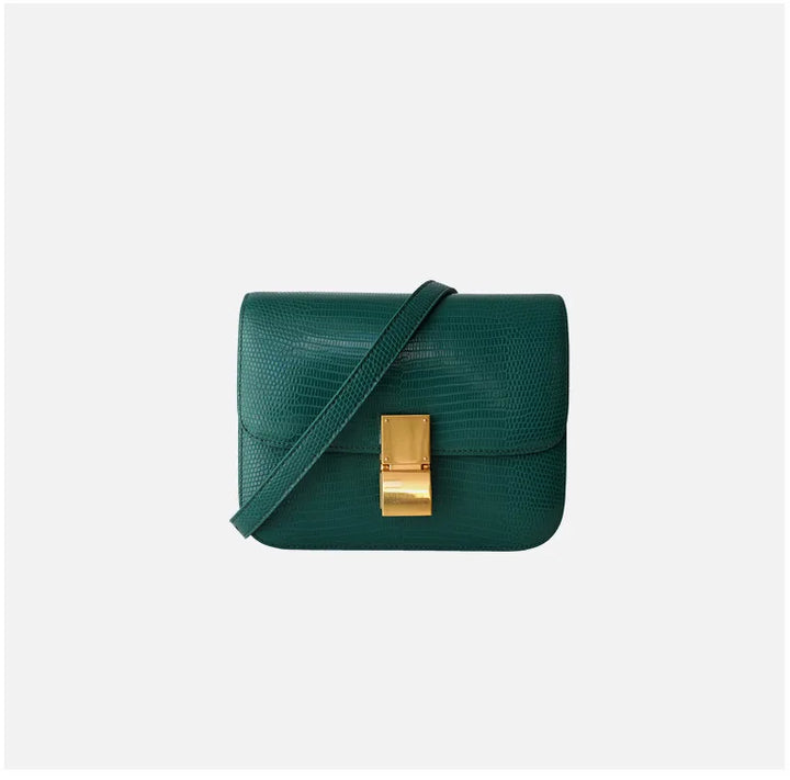 Fermoir luxe du sac à main femme croco, un détail sécurisé et raffiné.