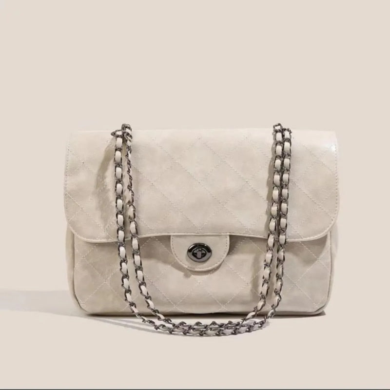 Sac à main noir pour femme, simili cuir vegan, avec bandoulière et anse chaîne. Idéal pour toutes occasions.