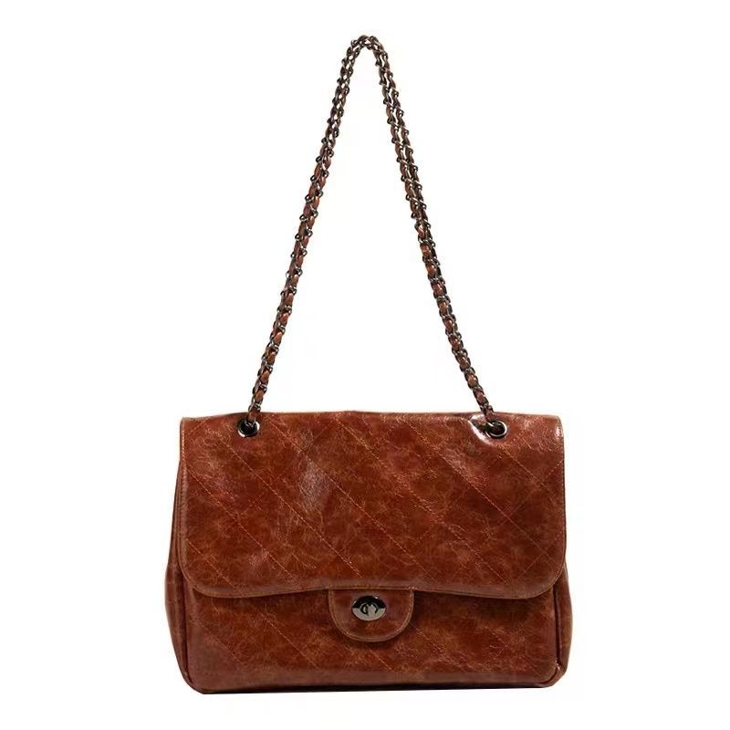 Sac épaule marron femme tendance en simili cuir, anse chaîne et bandoulière amovible. Style chic et moderne.