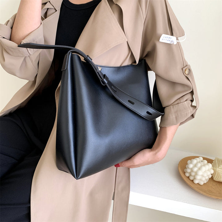 Sac à main noir intemporel pour femme, similicuir de qualité, élégant et pratique pour shopping