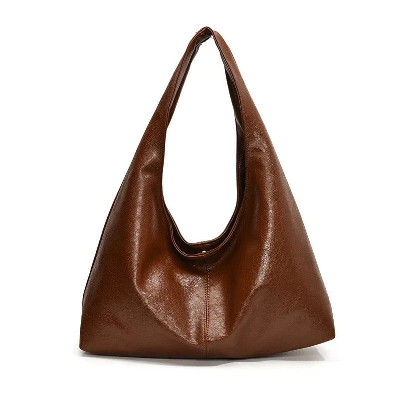 Sac à main épaule hobo pour femmes. Design épuré en similicuir, idéal pour un style chic et décontracté.