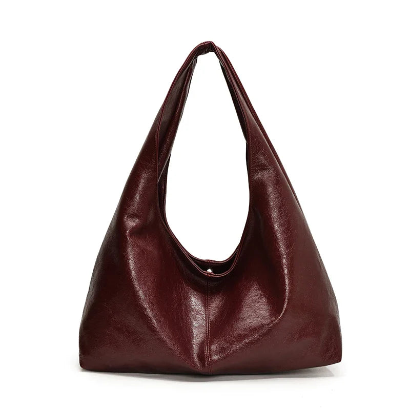 Sac à main hobo pour femmes, accessoire de mode intemporel. Similicuir, élégant et pratique pour le quotidien actif.