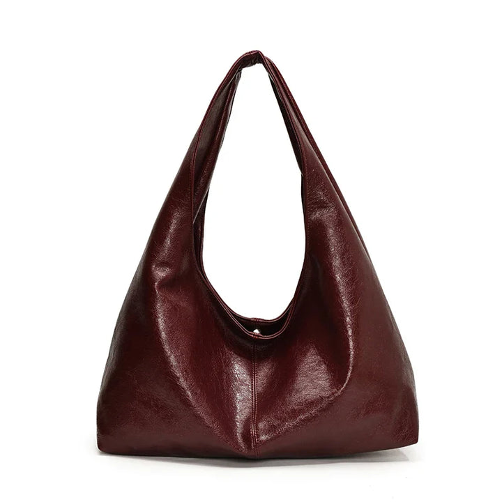 Sac à main hobo pour femmes, accessoire de mode intemporel. Similicuir, élégant et pratique pour le quotidien actif.