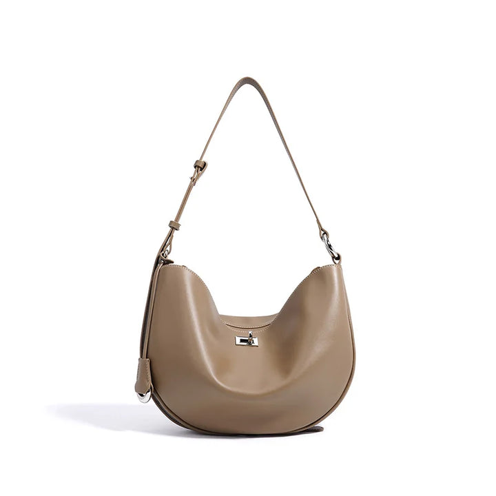 Sac à main hobo luxe et chic pour femme, en cuir vegan. Accessoire de mode polyvalent porté épaule.