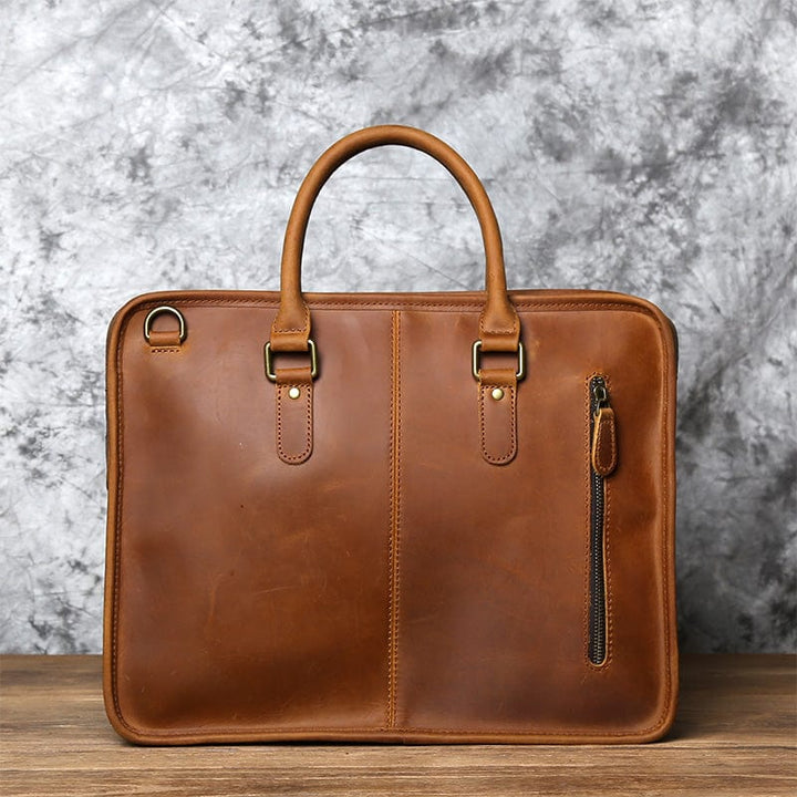 Sac de bureau homme en cuir véritable, avec poignée solide, pour un transport aisé et sécurisé.