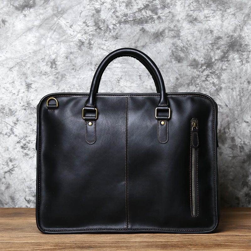 Sac bandoulière en cuir de vache, design minimaliste et chic, idéal pour l'homme stylé.