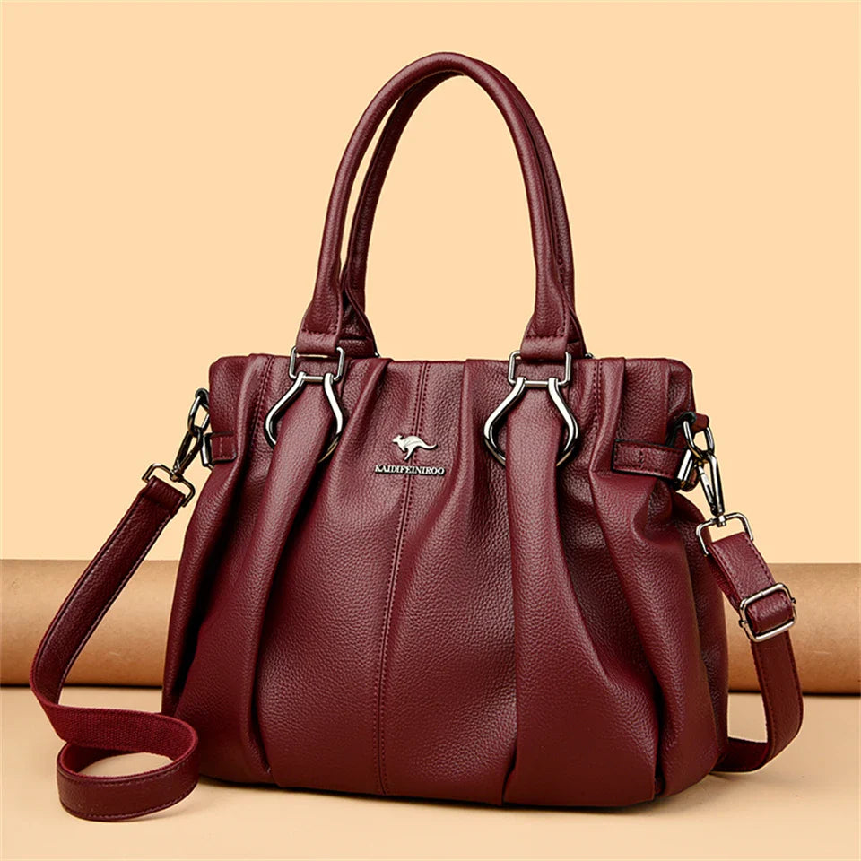 Sac à main élégant en cuir bordeaux pour femmes. Accessoire mode chic et intemporel avec bandoulière réglable.