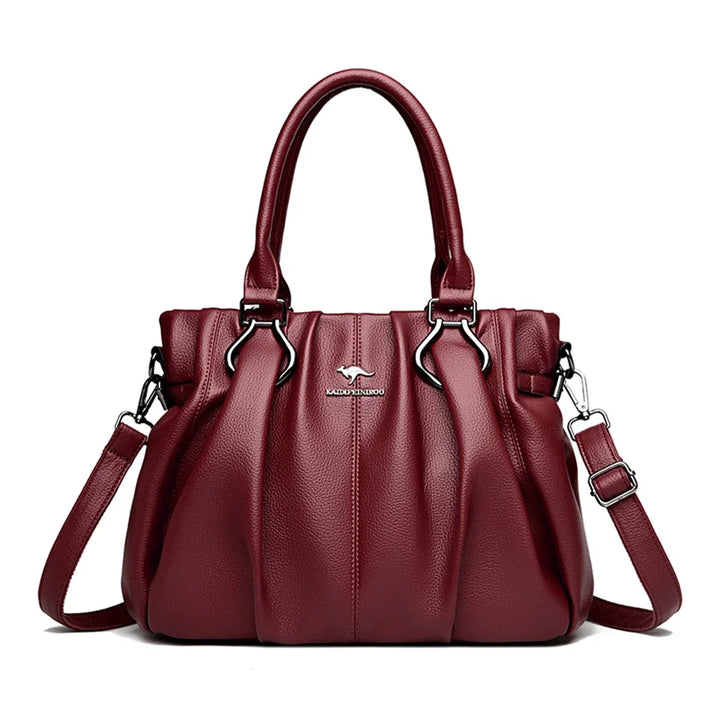 Sac à main en cuir bordeaux pour femme. Design intemporel et chic, parfait pour un look féminin et raffiné.