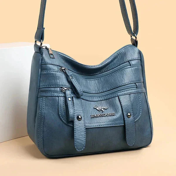 Sac rouge en cuir pour femme, style chic et tendance, idéal comme sac à main ou bandoulière quotidien.