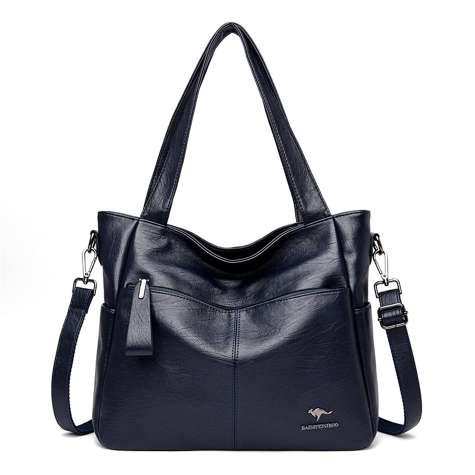 Sac cabas bleu en cuir synthétique pour femme, parfait pour accessoiriser une tenue élégante au quotidien.