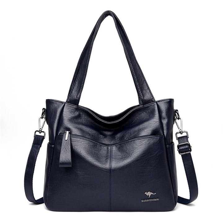 Sac cabas bleu en cuir synthétique pour femme, parfait pour accessoiriser une tenue élégante au quotidien.
