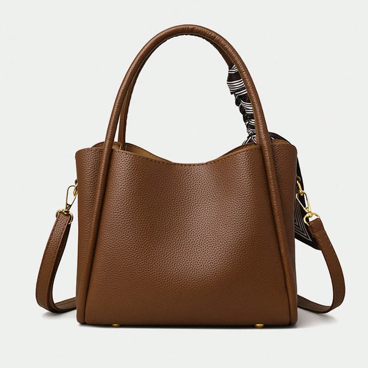 Sac à main élégant marron, accessoire de mode indispensable pour femme, style chic et polyvalent.