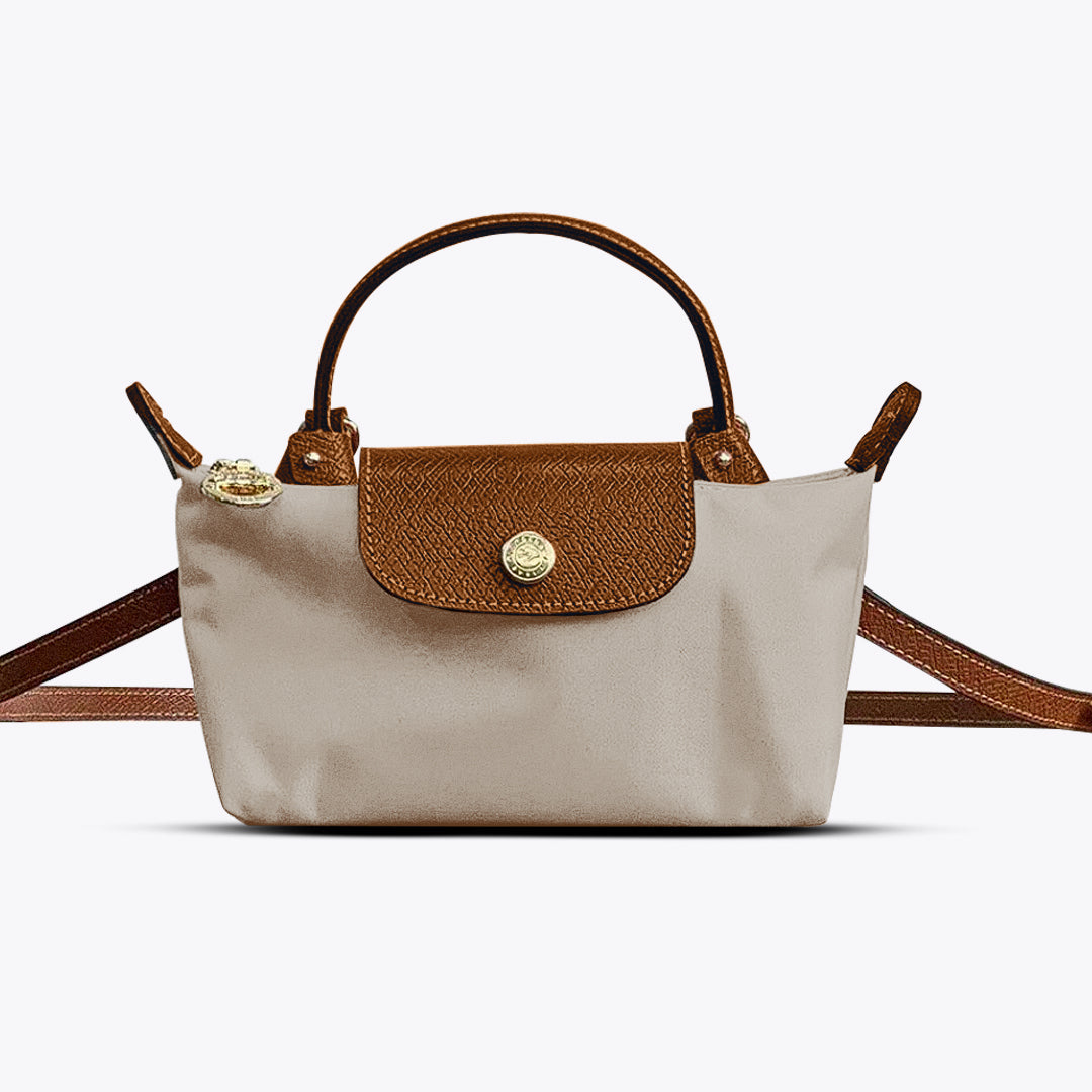 Sac à main moderne pour femme, design élégant en cuir synthétique. Parfait pour compléter votre look mode.
