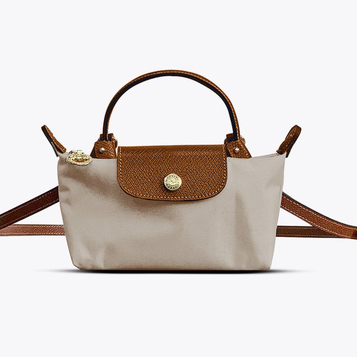 Sac à main moderne pour femme, design élégant en cuir synthétique. Parfait pour compléter votre look mode.