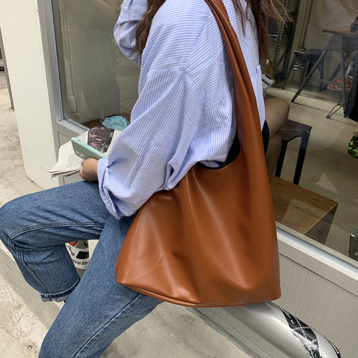 Sac à main camel polyvalent pour femmes, confort et style, parfait pour un usage quotidien.