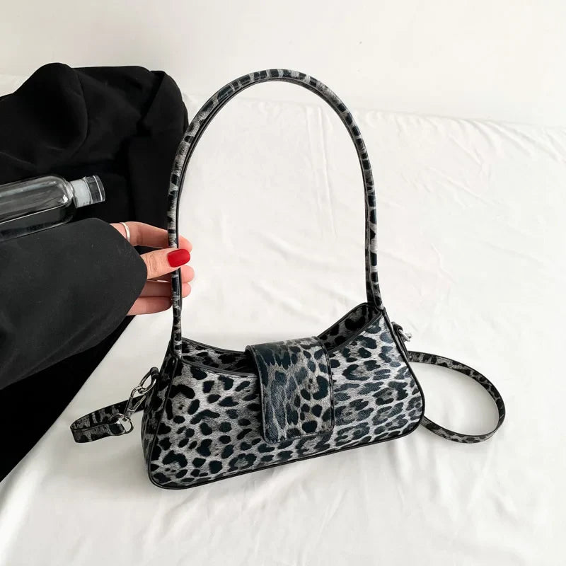 Sac à main léopard en cuir PU pour femme, motif animalier chic, idéal pour un look sophistiqué.