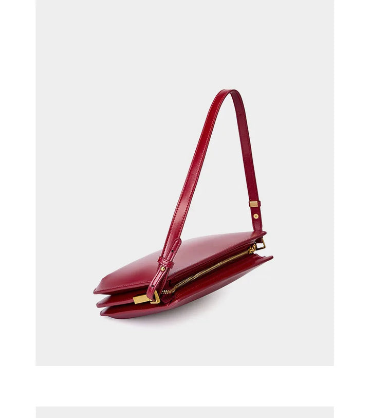 Ensemble de trois sacs à main luxe en cuir véritable: noir, jaune et rouge, illustrant la gamme de couleurs mode.