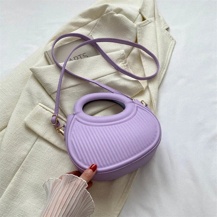 Sac bandoulière femme noir, petit format, matelassé, chic et pratique au quotidien.