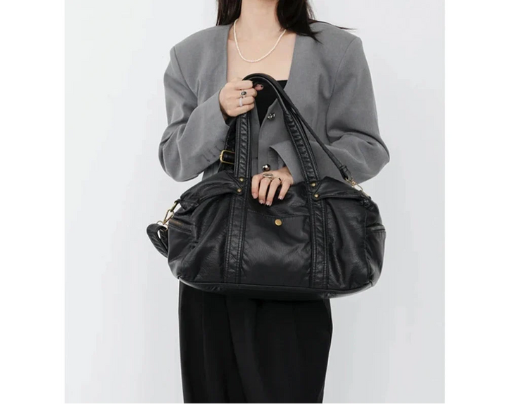 Sac à main noir femme pratique, porté épaule ou bandoulière. Grand format pour étudiante, idéal pour les cours.