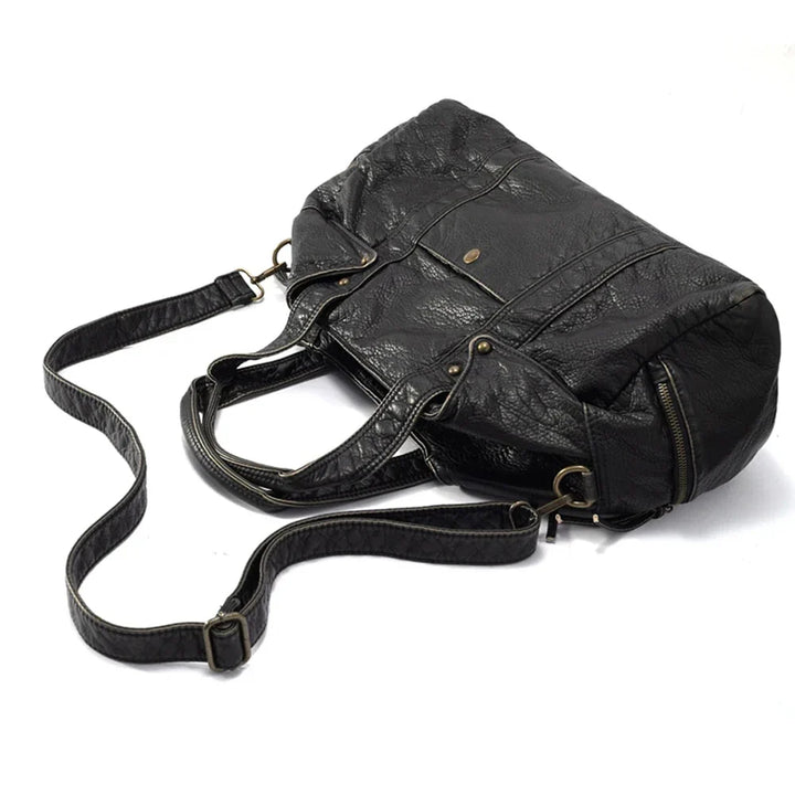 Grand sac à main noir femme étudiante, en cuir synthétique. Parfait pour les cours, mode et pratique à l'épaule.