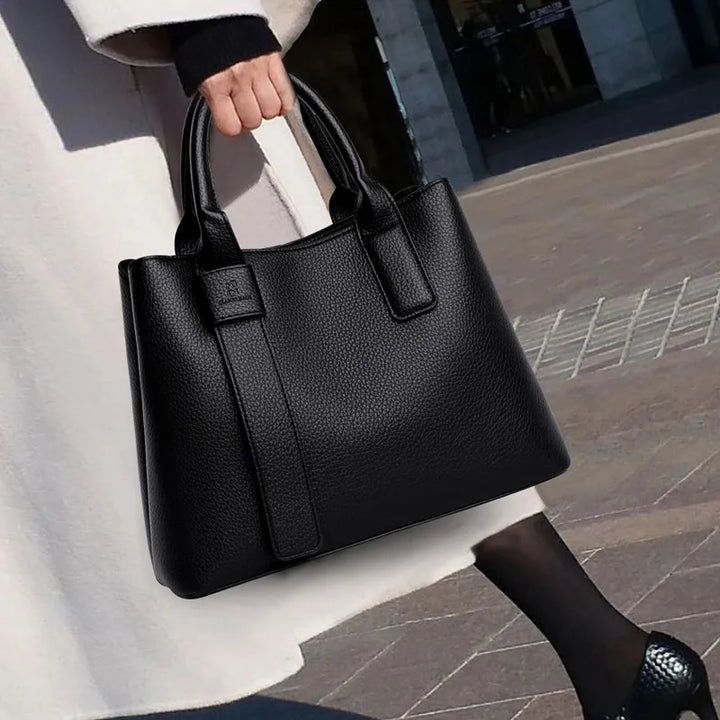 Sac à main noir moyen élégant en cuir vegan pour femme, idéal pour le quotidien.