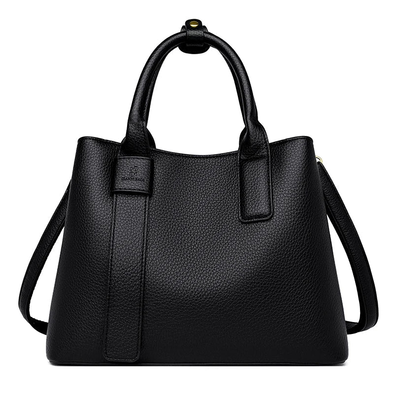 Accessoire mode féminin: sac noir chic de taille moyenne en cuir vegan, parfait pour toute occasion.
